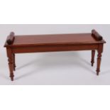 A Victorian style mahogany window seat, raised on ring turned tapering supports, w.112cm, d.33cm, h.