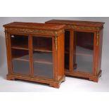 A pair of late Victorian satinwood and gilt metal mounted vitrines,