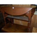 An Edwardian walnut dropflap two tier occasional table,