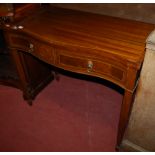 A reproduction mahogany serpentine front two drawer side table,