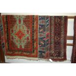 Three various Persian woollen rugs,