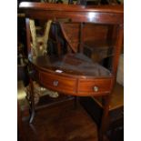 An early 19th century mahogany corner two tier wash stand (with later replacement top)