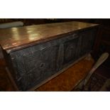 An antique line carved stained hardwood hinge-top long blanket box, w.