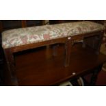 A circa 1900 walnut and floral studded upholstered window seat, in the Georgian taste (some losses),