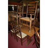 An oak refectory table, raised on notched square cut supports united by twin central stretcher,