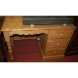 A modern pine kneehole single pedestal dressing table, w.