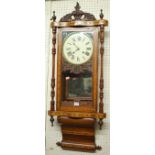 A late Victorian walnut and inlaid droptrunk wall clock