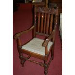 A 1930s barleytwist oak slatback open elbow chair