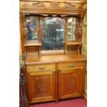 An Edwardian low relief carved walnut mirrorback sideboard, w.