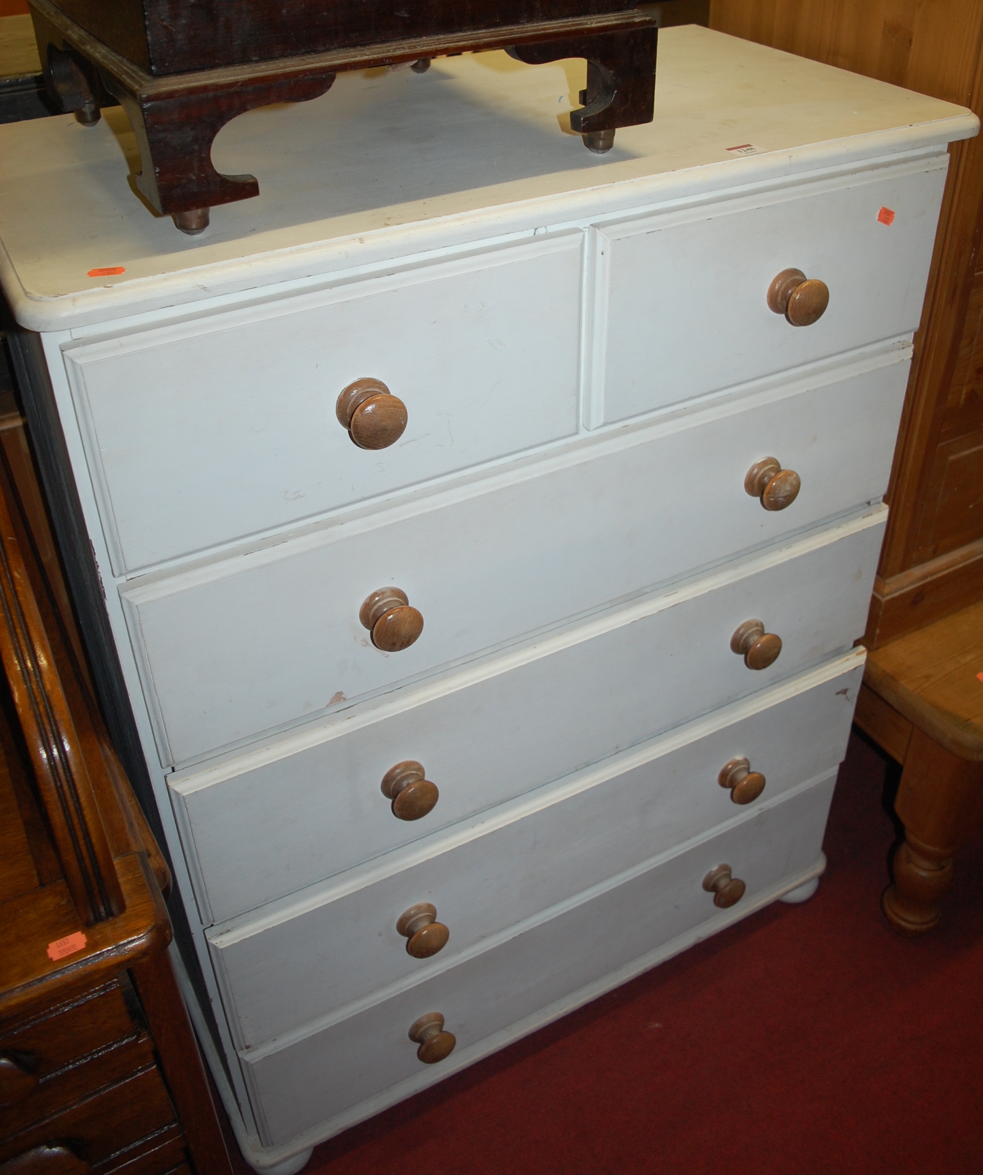 A modern white painted pine round cornered chest of two short over four long drawers, w.
