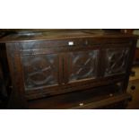 A circa 1700 joined oak three panel coffer, having loop hinges, fitted candle box,
