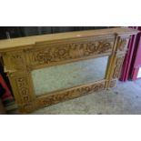 A contemporary carved hardwood rectangular overmantel mirror, having floral scroll border, w.