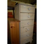 A modern lined pine narrow chest of six drawers;