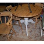 A modern pine circular pedestal breakfast table,