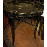 A Victorian papier mache polychrome painted and gilt decorated shaped tray table of good size,