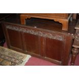 A circa 1700 joined oak three-panelled hinge top coffer,