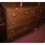 An early 19th century oak square front chest of two short over three long graduated drawers,