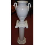 A contemporary glazed ceramic pedestal vase on stand,