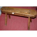 An antique rustic elm twin milking stool,