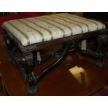 A circa 1900 carved and ebonised square section footstool of good size, in the Louis XIV style, w.