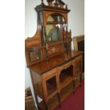 A circa 1900 rosewood, satinwood, and bone inlaid mirrorback side cabinet, w.