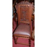 A set of four linenfold panelled and low relief carved hardwood dining chairs,