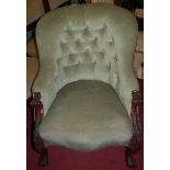 An early Victorian rosewood framed and blue buttonback upholstered tub armchair,