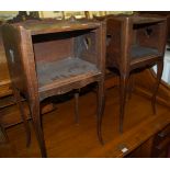 A pair of circa 1900 French oak two tier open bedside tables, each with heart shaped cut-out motifs,