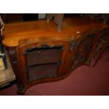 A mid Victorian figured walnut serpentine front double door side cabinet,
