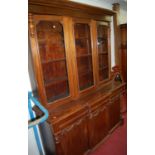 A mahogany breakfront bookcase cupboard,