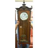 A late 19th century walnut and ebonised Vienna wall clock,