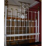 A Victorian white painted, wrought iron and brass double bedstead,