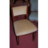 A set of four Edwardian carved walnut dining chairs,