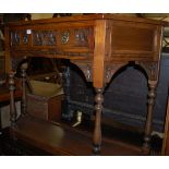A moulded oak single drawer credence table having platform undertier,