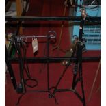An Edwardian black painted wrought iron telescopic paraffin stand;