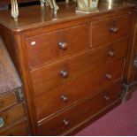 A mid Victorian mahogany round cornered chest of two short over three long drawers,