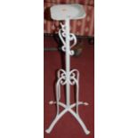 A white painted metal telescopic plant stand