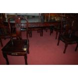 A contemporary Chinese hardwood dining suite comprising extending dining table with two extra drop