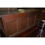 An 18th century joined oak four panelled hinge-top coffer, w.