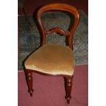 A set of four Victorian mahogany balloon back dining chairs