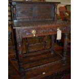 A circa 1900 low relief heavily carved oak single drawer side table,