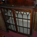 A 1930s mahogany ledgeback bowfront double door glazed china display cabinet,