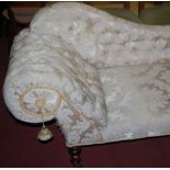 A Victorian mahogany framed and later floral buttonback upholstered scroll-end chaise-longue