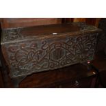 A pair of Arts & Crafts low relief carved oak hinge-top blanket boxes,