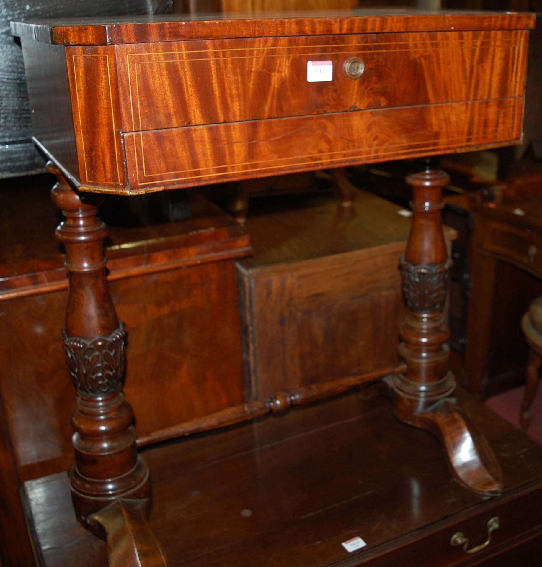A 19th century Continental mahogany and satinwood strung hinge-top sewing table,