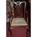 A Chippendale style mahogany open armchair;