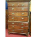 A George III oak chest-on-chest, the upper section having fluted quarter turned pilasters,