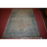 A Persian woollen 'Tree of Life' rug (worn),