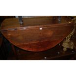 An early 19th century mahogany drop leaf dining table,