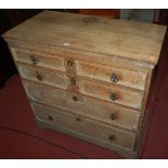 A 19th century limed oak square front chest of four long drawers, width 94.